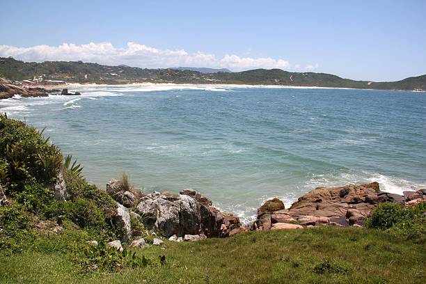 Empty beach at Praia do Rosa, the perfect place for those seeking respite in the midst of nature.